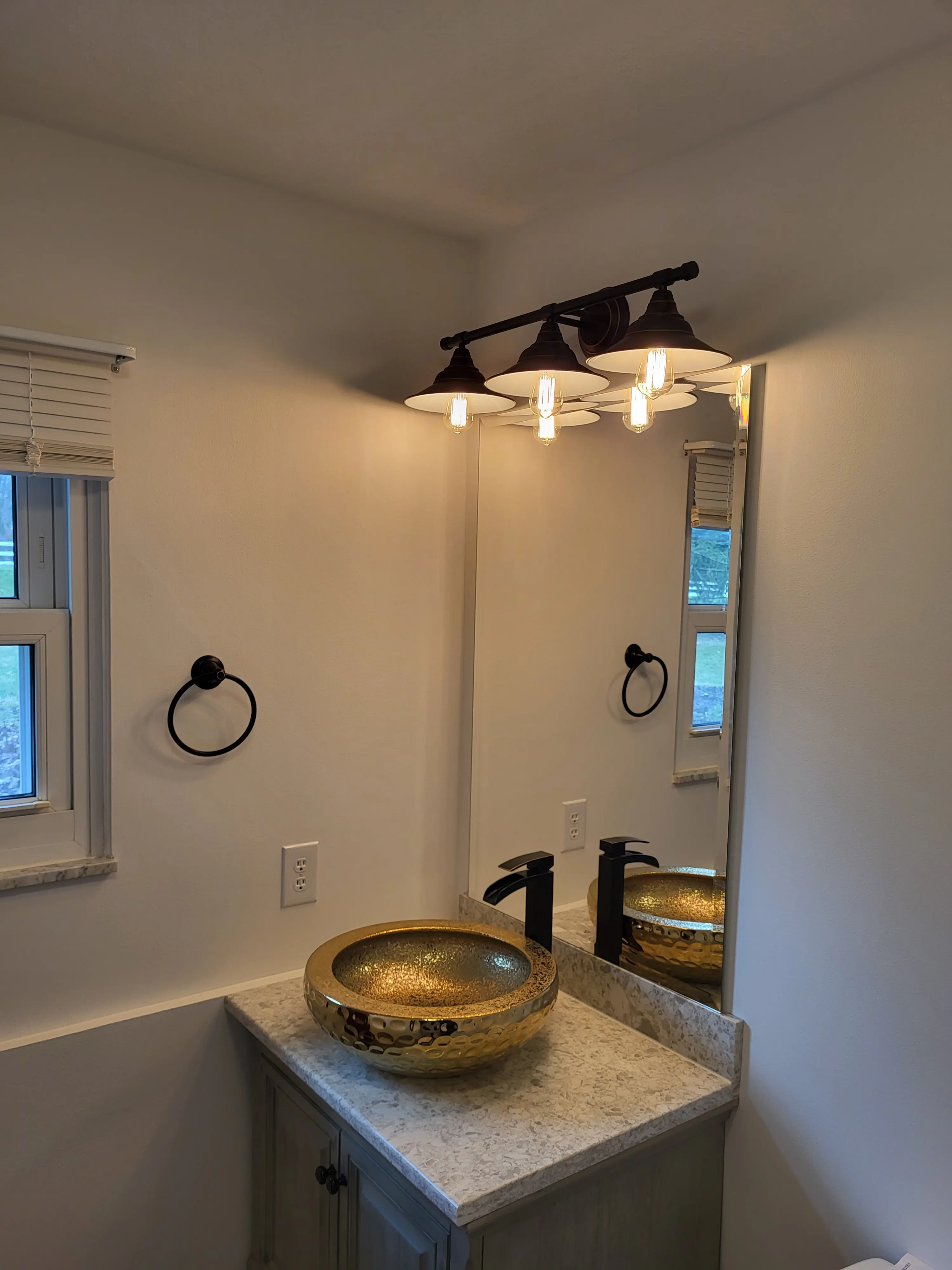 Bathroom vanity, sink, and lighting installation